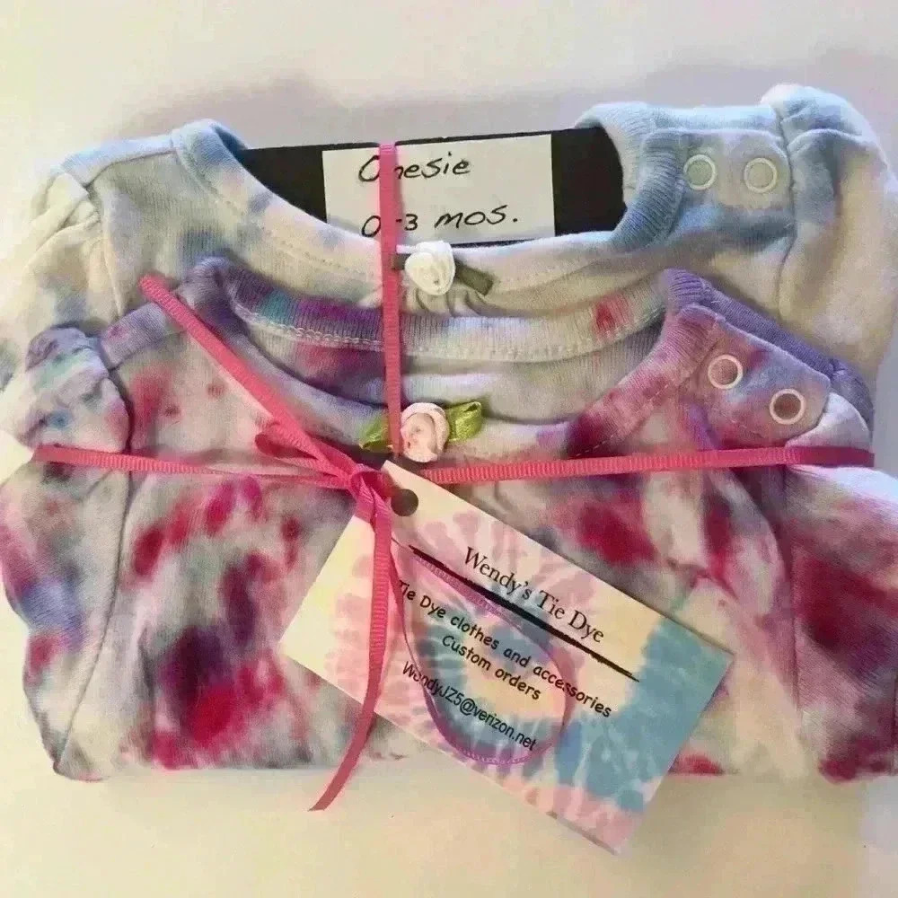 Set of 2 New tie dye onesies with rose sewn on.